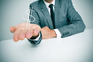 bigstock-a-businessman-sitting-in-a-des-58975436